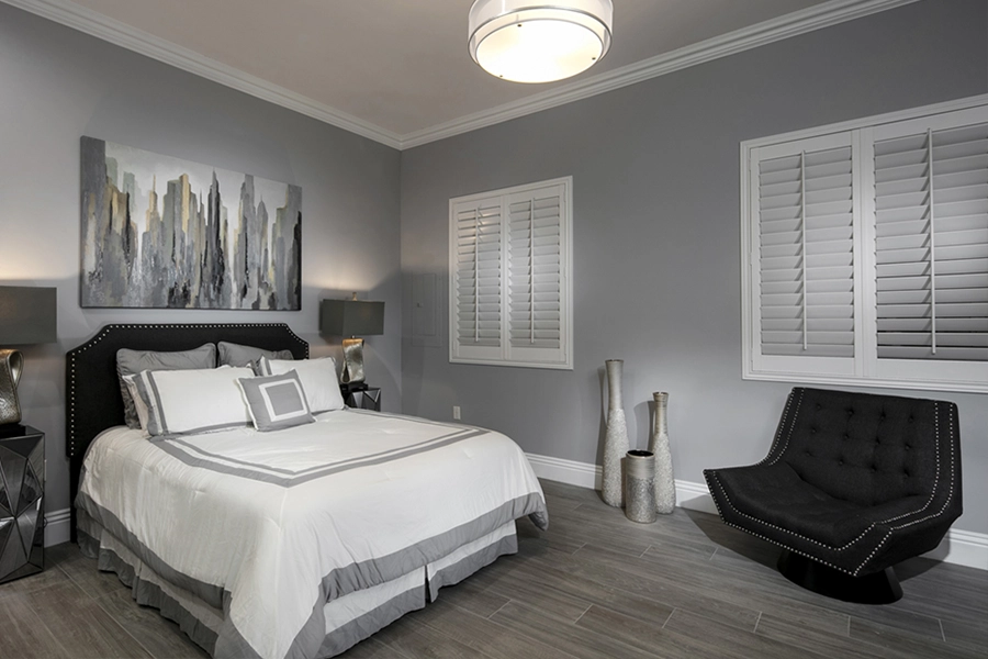 Close your custom Polywood shutters to beat the heat and keep your Southern California bedroom cool. White Polywood shutters on bedroom windows
